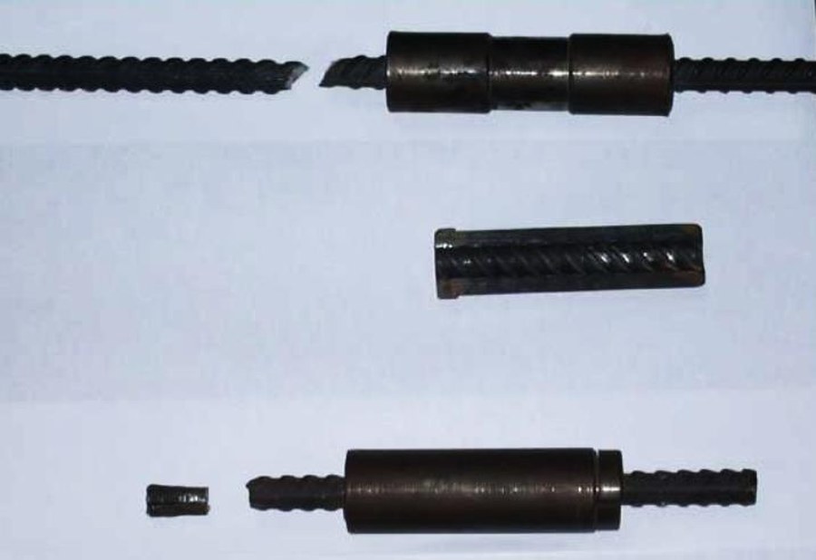 A coupled bar, a machined sleeve half showing the female grooves, and a complete coupler on a bar.