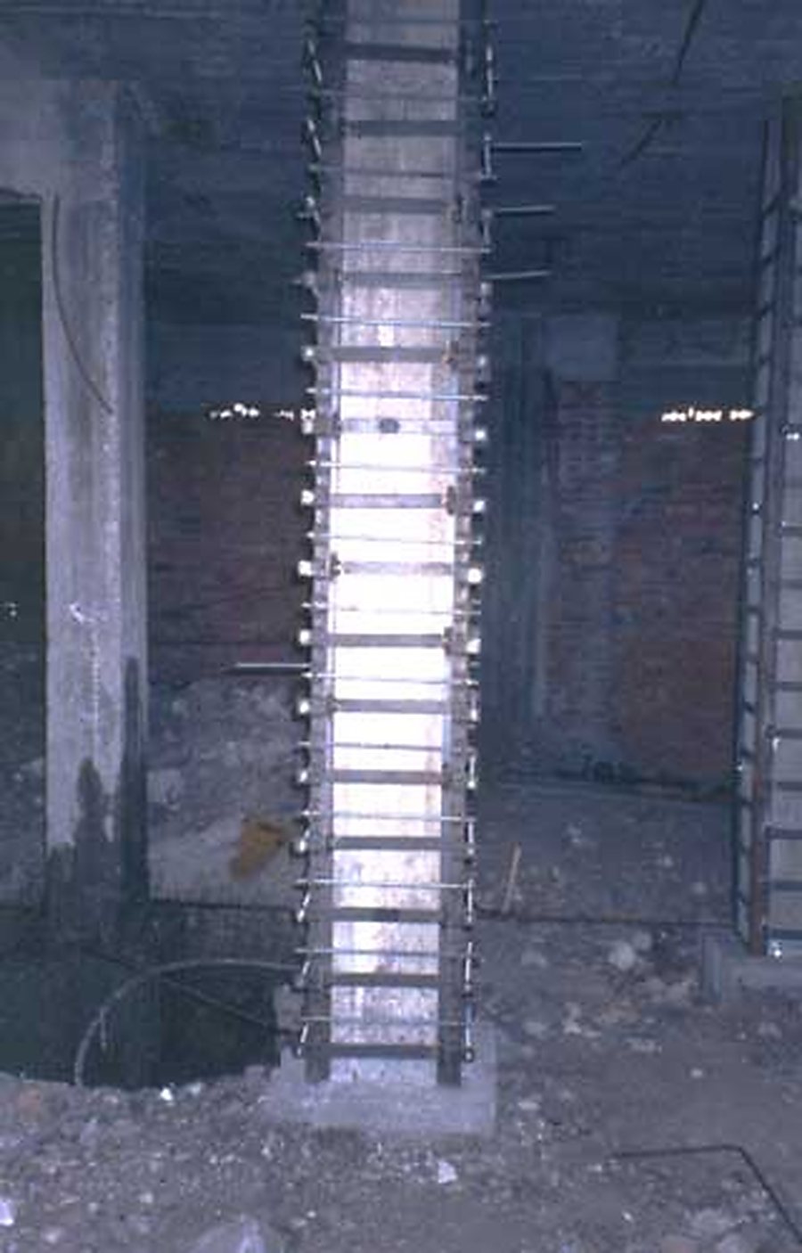 Hexagonal column strengthened with angles and strips.
