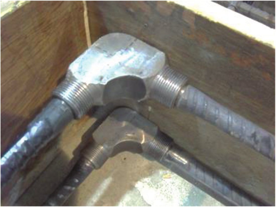 The L-shaped mechanical coupler itself.